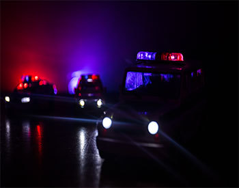 Police cars at night.